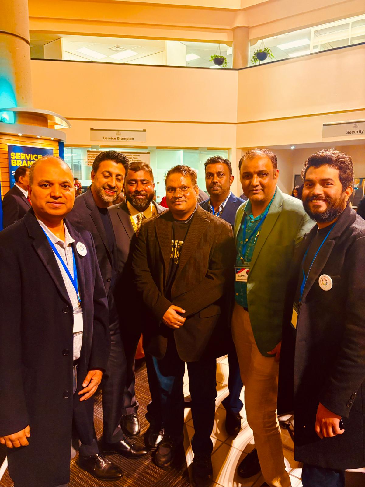 FXHollywood Films at a group event with multiple people present